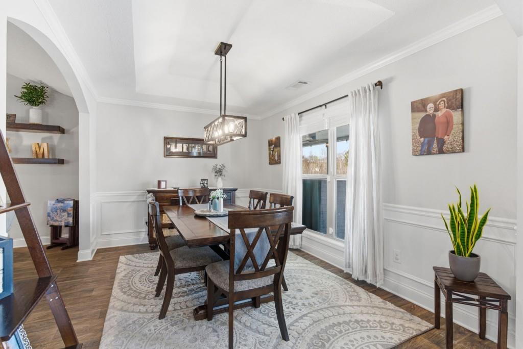 844 River Mist Circle Jefferson, GA 30549 - Photo 16 of 35 a view of a dining room with furniture window and wooden floor