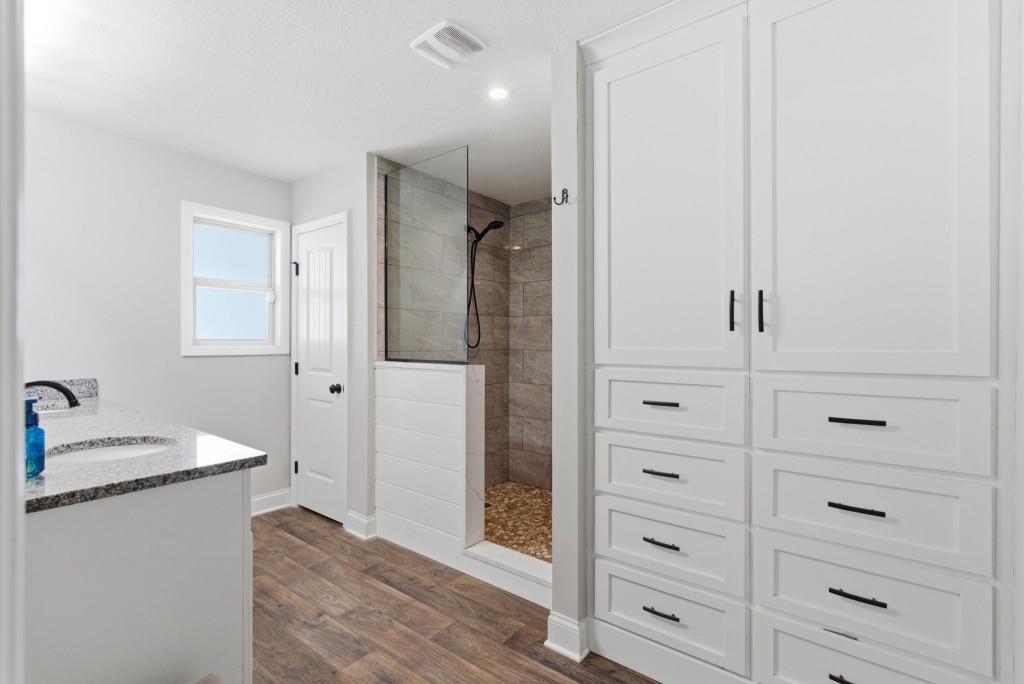 844 River Mist Circle Jefferson, GA 30549 - Photo 27 of 35 a bathroom with a shower and a sink