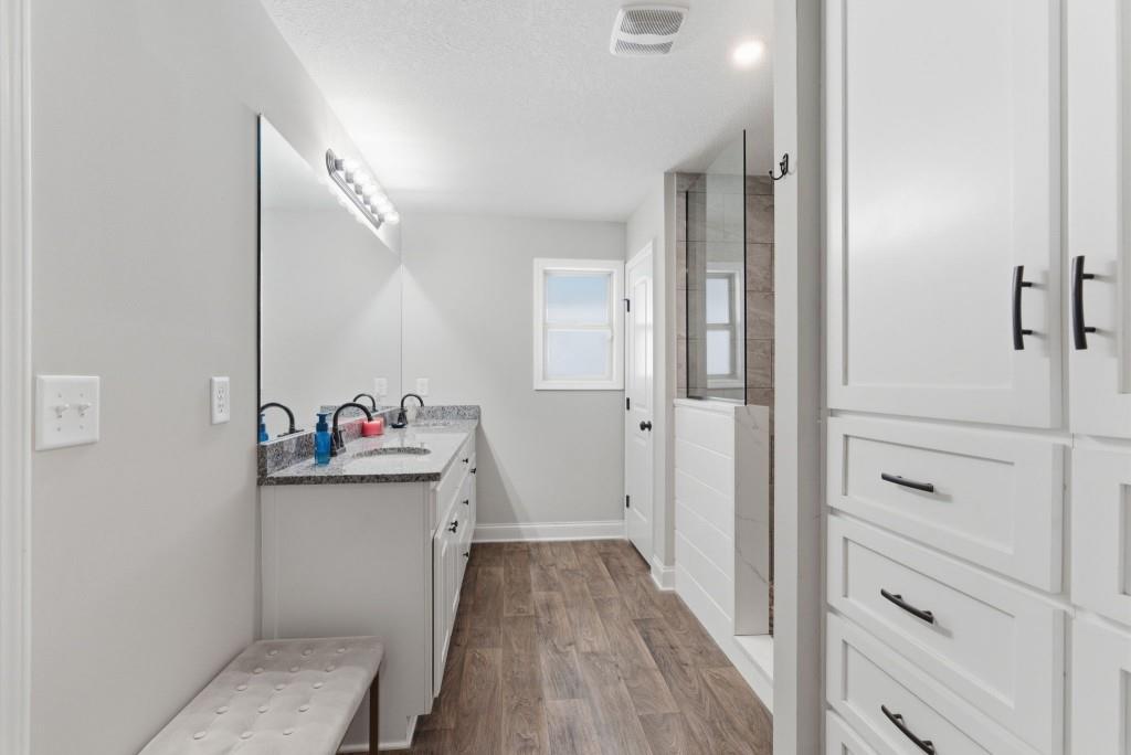 844 River Mist Circle Jefferson, GA 30549 - Photo 28 of 35 a view of a hallway and closet with wooden floor