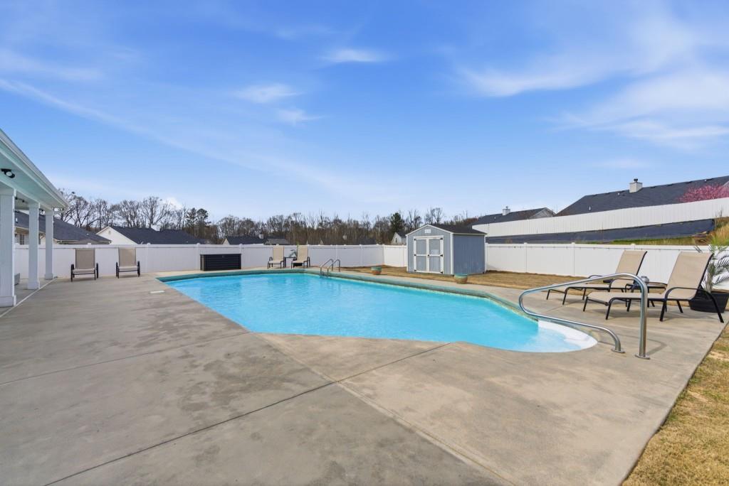 844 River Mist Circle Jefferson, GA 30549 - Photo 31 of 35 a view of a swimming pool and lounge chair