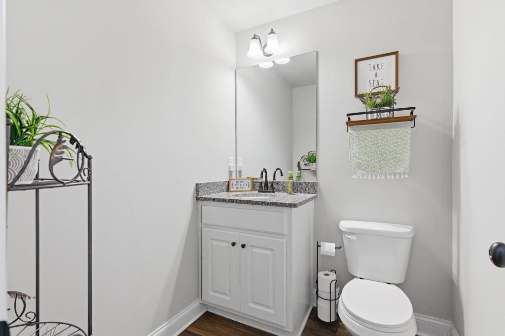 844 River Mist Circle Jefferson, GA 30549 - Photo 8 of 35 a bathroom with a toilet a sink and mirror