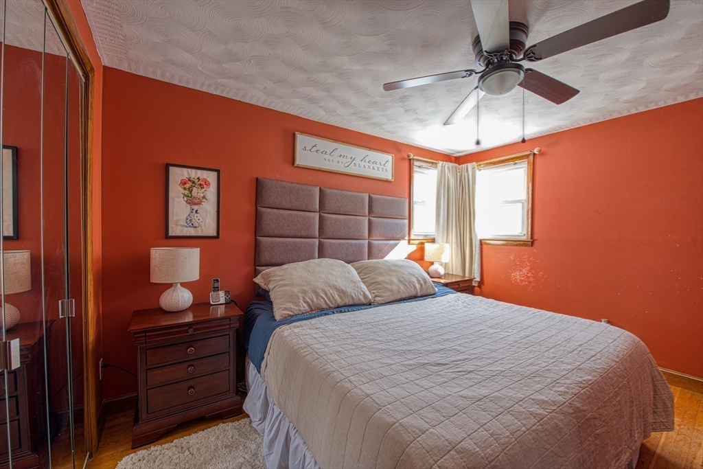 12 Brewster Road Randolph, MA 02368 - Photo 11 of 27 a bedroom with a bed and a window
