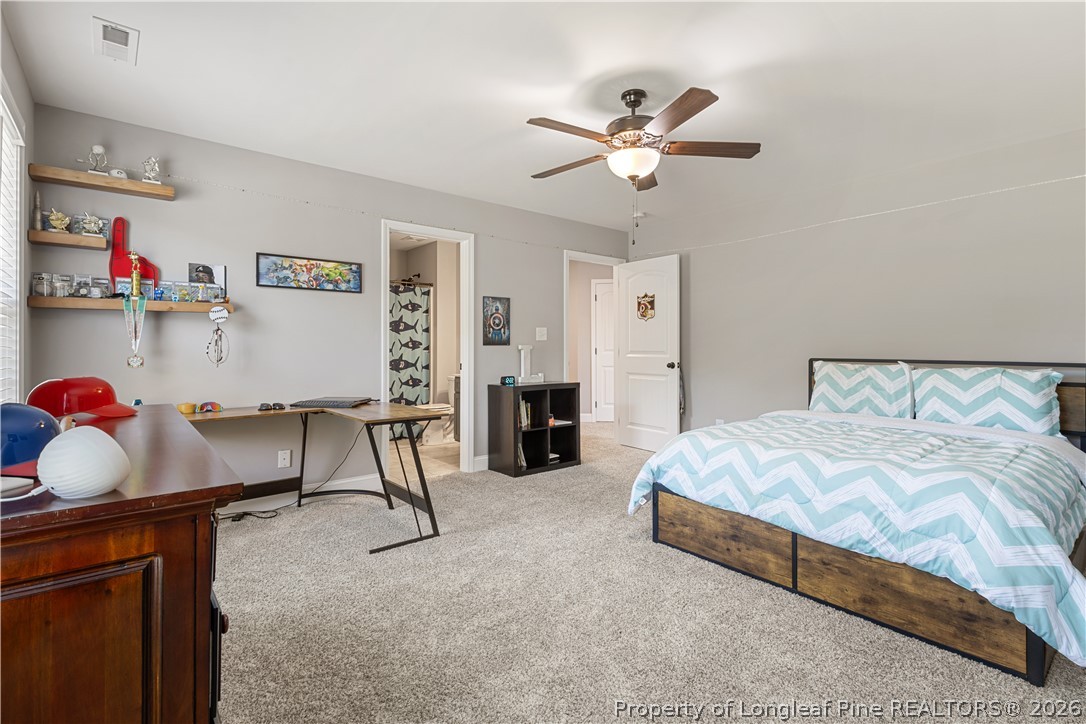 137 Minter School Road Sanford, NC 27332 - Photo 34 of 50 a bedroom with a bed and cabinets