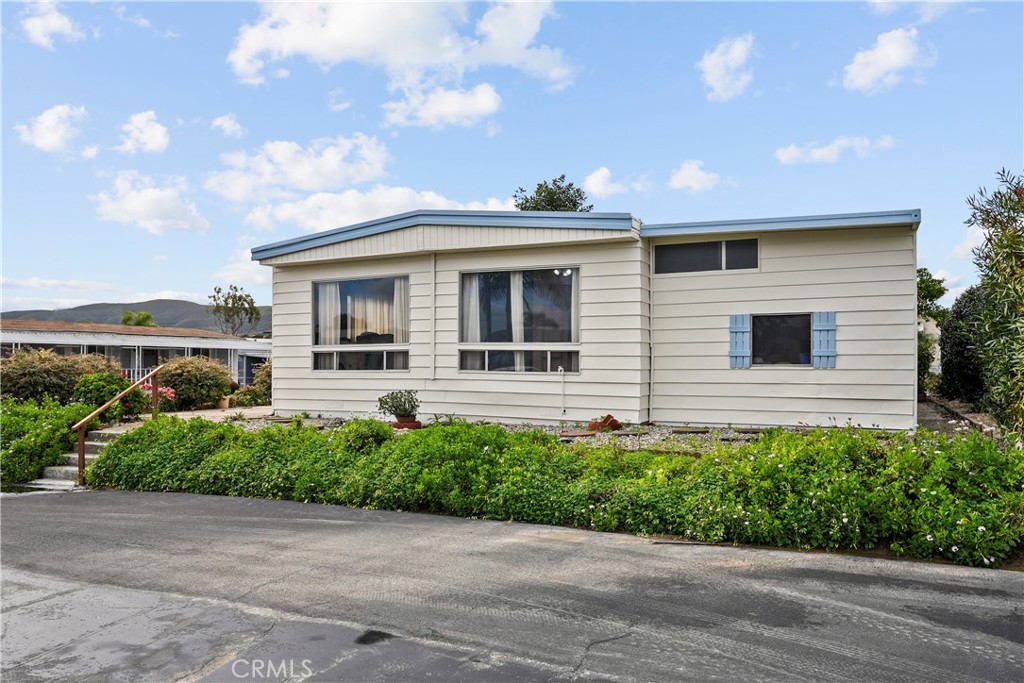 650 South Rancho Santa Fe Road, Unit 106 San Marcos, CA 92078 - Photo 11 of 55 a front view of a house with a yard