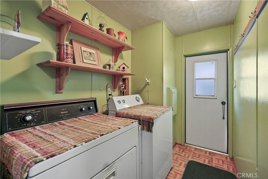 650 South Rancho Santa Fe Road, Unit 106 San Marcos, CA 92078 - Photo 16 of 55 a utility room with dryer and washer