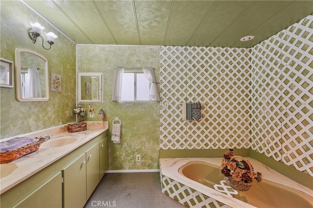 650 South Rancho Santa Fe Road, Unit 106 San Marcos, CA 92078 - Photo 19 of 55 a bathroom with a bathtub sink vanity and toilet