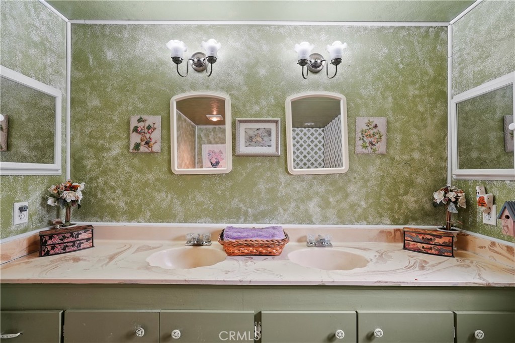 650 South Rancho Santa Fe Road, Unit 106 San Marcos, CA 92078 - Photo 24 of 55 a bathroom with a sink and a mirror