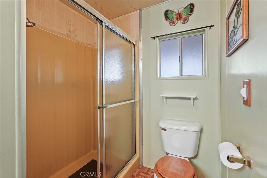 650 South Rancho Santa Fe Road, Unit 106 San Marcos, CA 92078 - Photo 26 of 55 a bathroom with a toilet and a shower