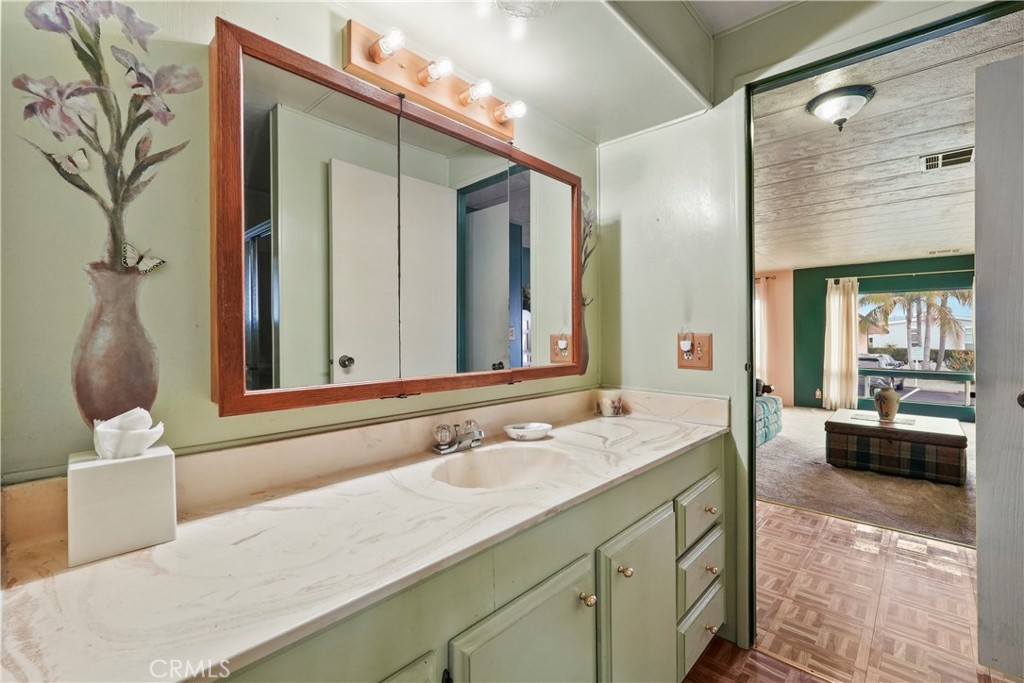 650 South Rancho Santa Fe Road, Unit 106 San Marcos, CA 92078 - Photo 27 of 55 a bathroom with a sink and a mirror