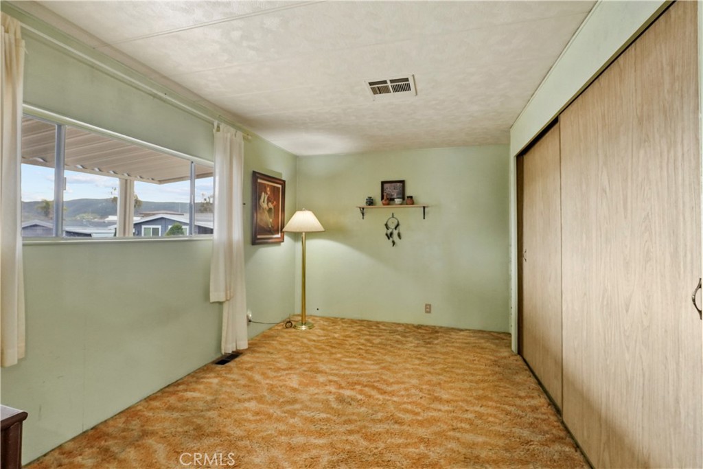 650 South Rancho Santa Fe Road, Unit 106 San Marcos, CA 92078 - Photo 28 of 55 a view of a room with a flat screen tv