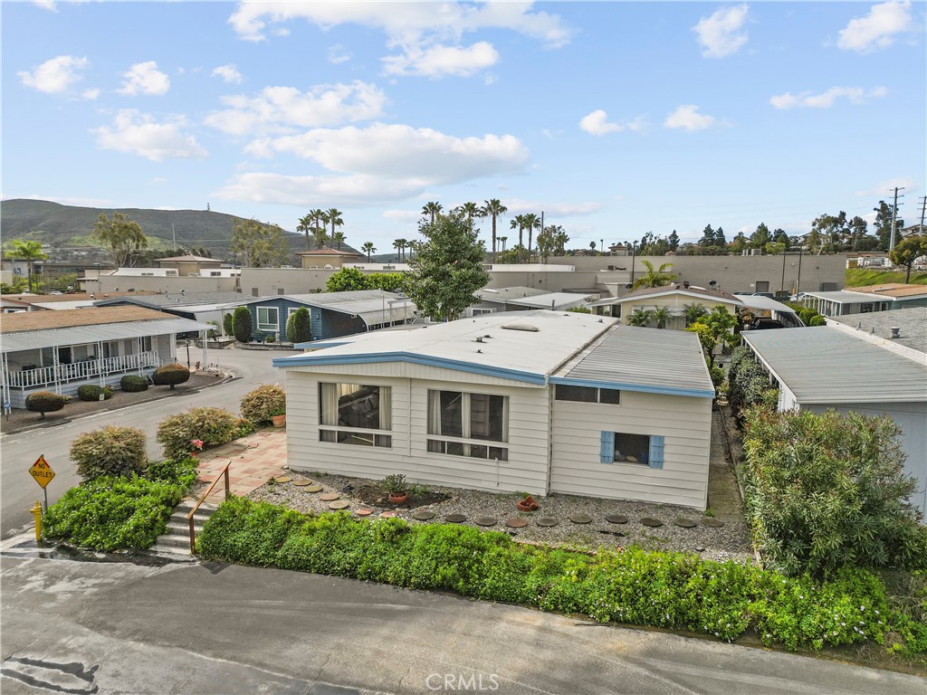 650 South Rancho Santa Fe Road, Unit 106 San Marcos, CA 92078 - Photo 3 of 55 a aerial view of a house with a yard and potted plants