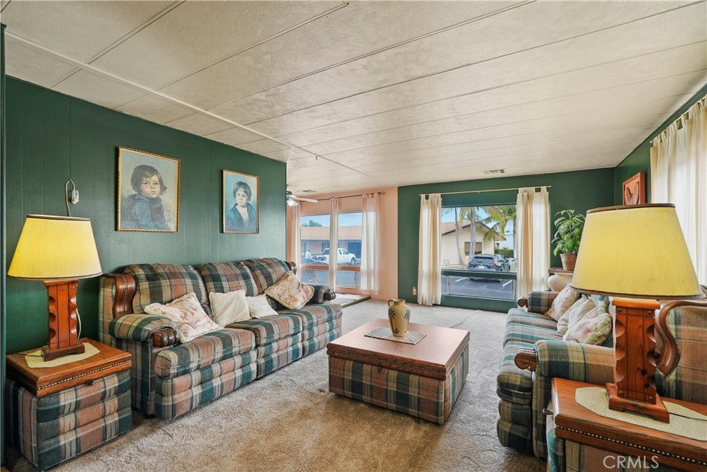 650 South Rancho Santa Fe Road, Unit 106 San Marcos, CA 92078 - Photo 31 of 55 a living room with furniture and a lamp