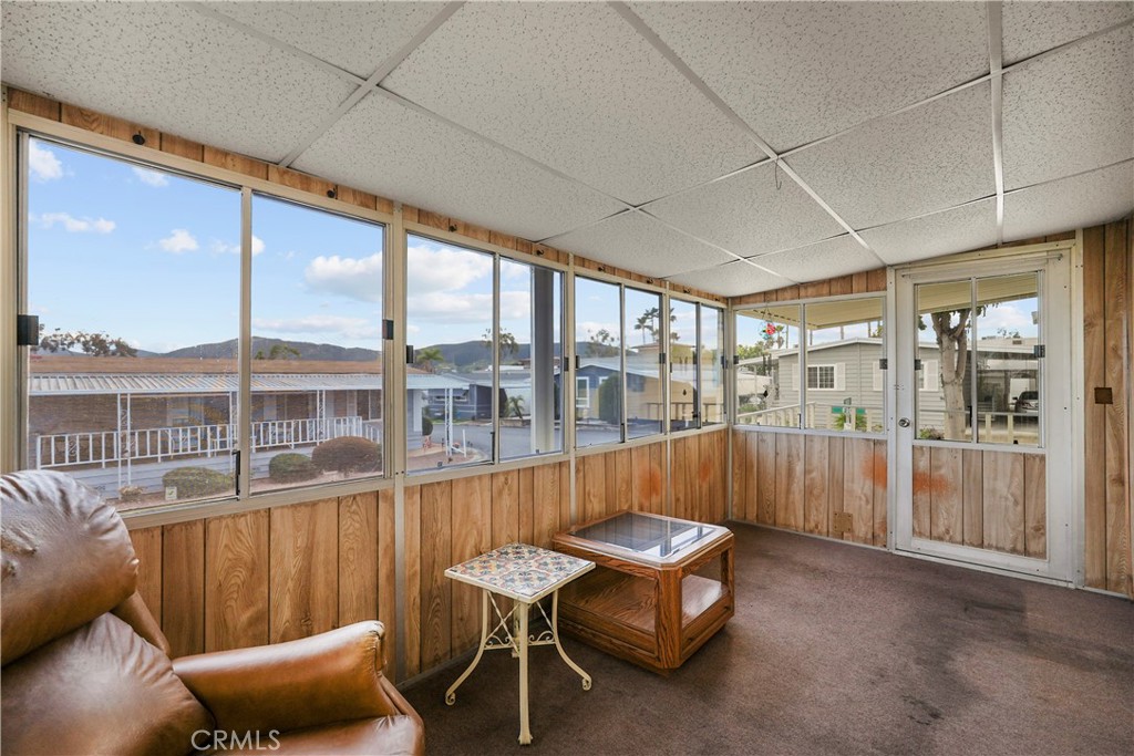 650 South Rancho Santa Fe Road, Unit 106 San Marcos, CA 92078 - Photo 33 of 55 a view of a porch with furniture and a yard