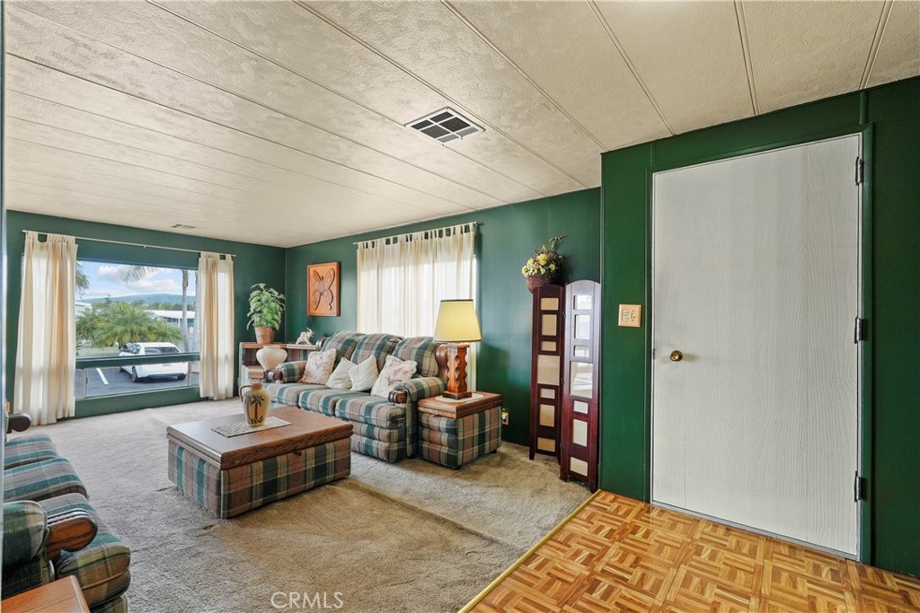 650 South Rancho Santa Fe Road, Unit 106 San Marcos, CA 92078 - Photo 34 of 55 a living room with furniture and a large window