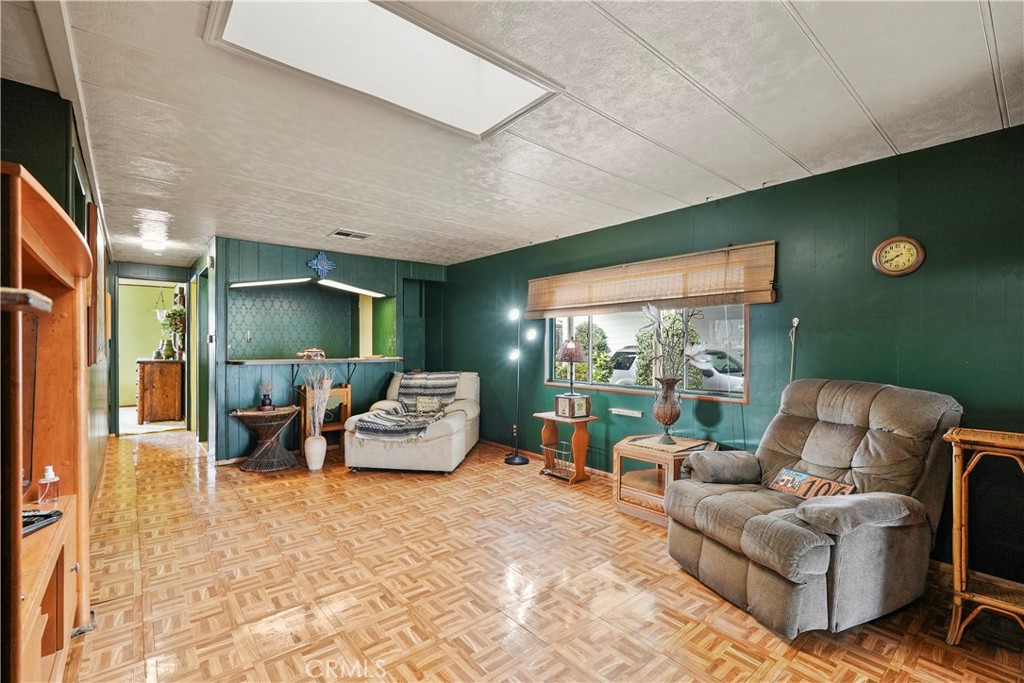 650 South Rancho Santa Fe Road, Unit 106 San Marcos, CA 92078 - Photo 35 of 55 a outdoor living space with furniture potted plant and a large window