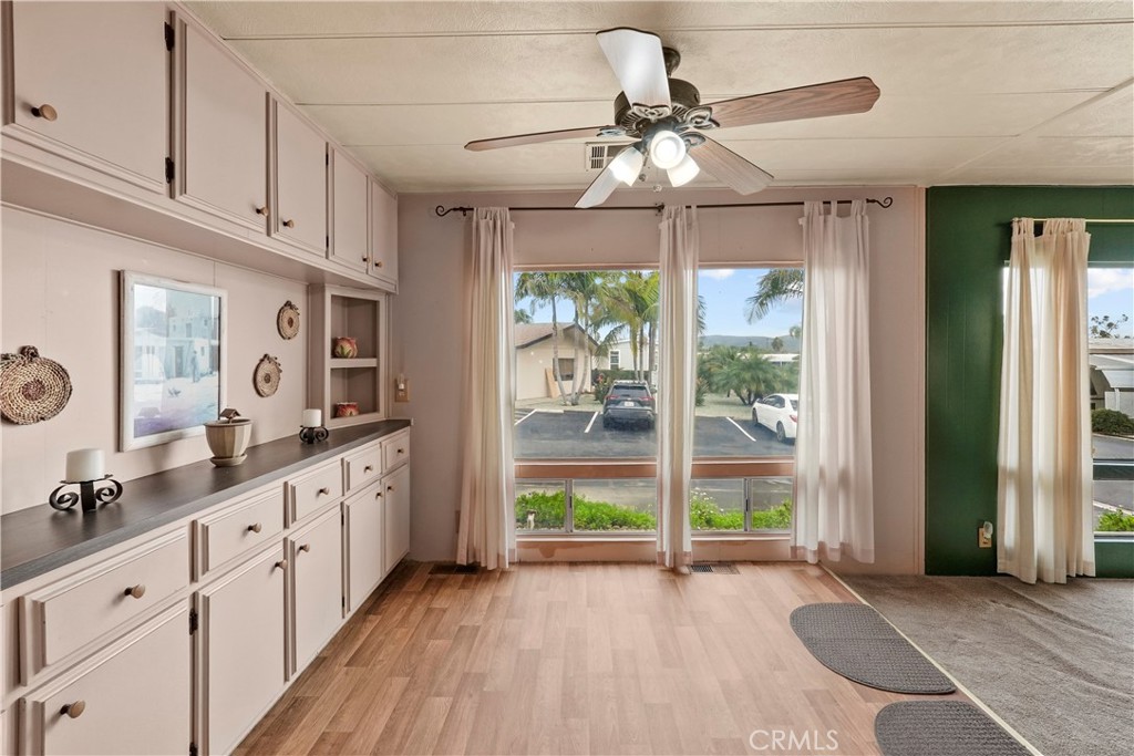 650 South Rancho Santa Fe Road, Unit 106 San Marcos, CA 92078 - Photo 36 of 55 a view of a kitchen with wooden floor and a window