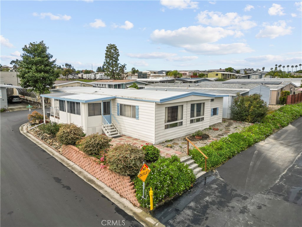 650 South Rancho Santa Fe Road, Unit 106 San Marcos, CA 92078 - Photo 4 of 55 a front view of a house with garden