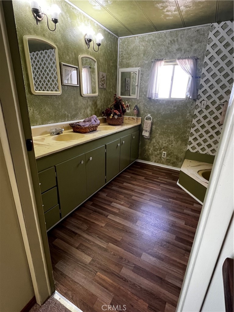 650 South Rancho Santa Fe Road, Unit 106 San Marcos, CA 92078 - Photo 44 of 55 a bathroom with a sink mirror and tub