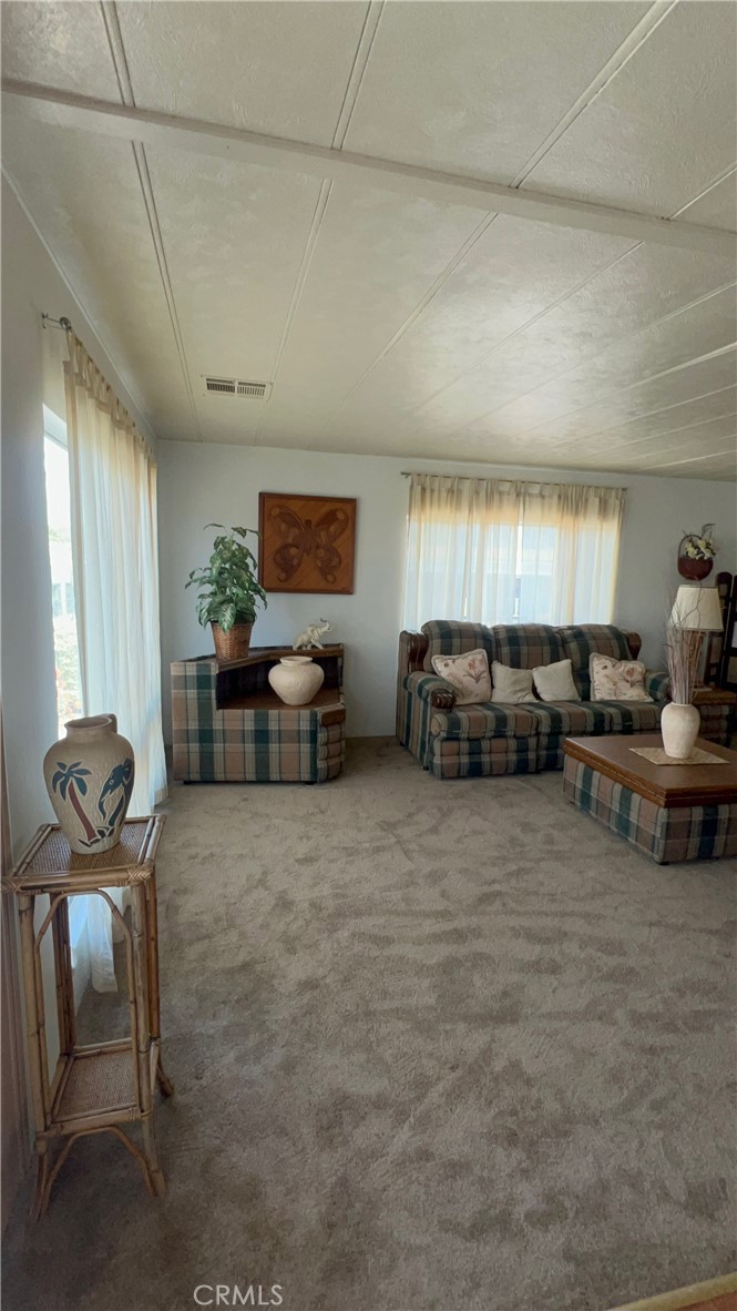 650 South Rancho Santa Fe Road, Unit 106 San Marcos, CA 92078 - Photo 54 of 55 a living room with furniture