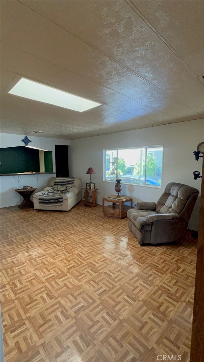650 South Rancho Santa Fe Road, Unit 106 San Marcos, CA 92078 - Photo 55 of 55 a living room with furniture and a large window