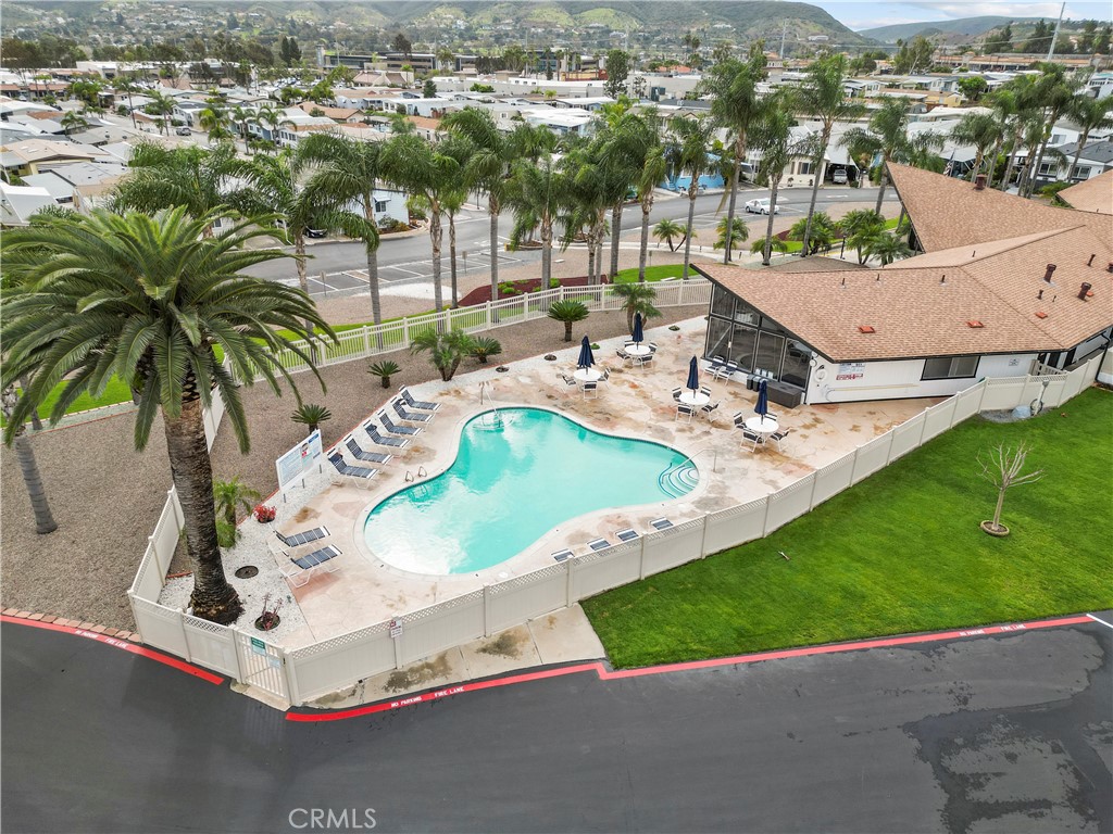 650 South Rancho Santa Fe Road, Unit 106 San Marcos, CA 92078 - Photo 7 of 55 an aerial view of a house with a yard and lake view