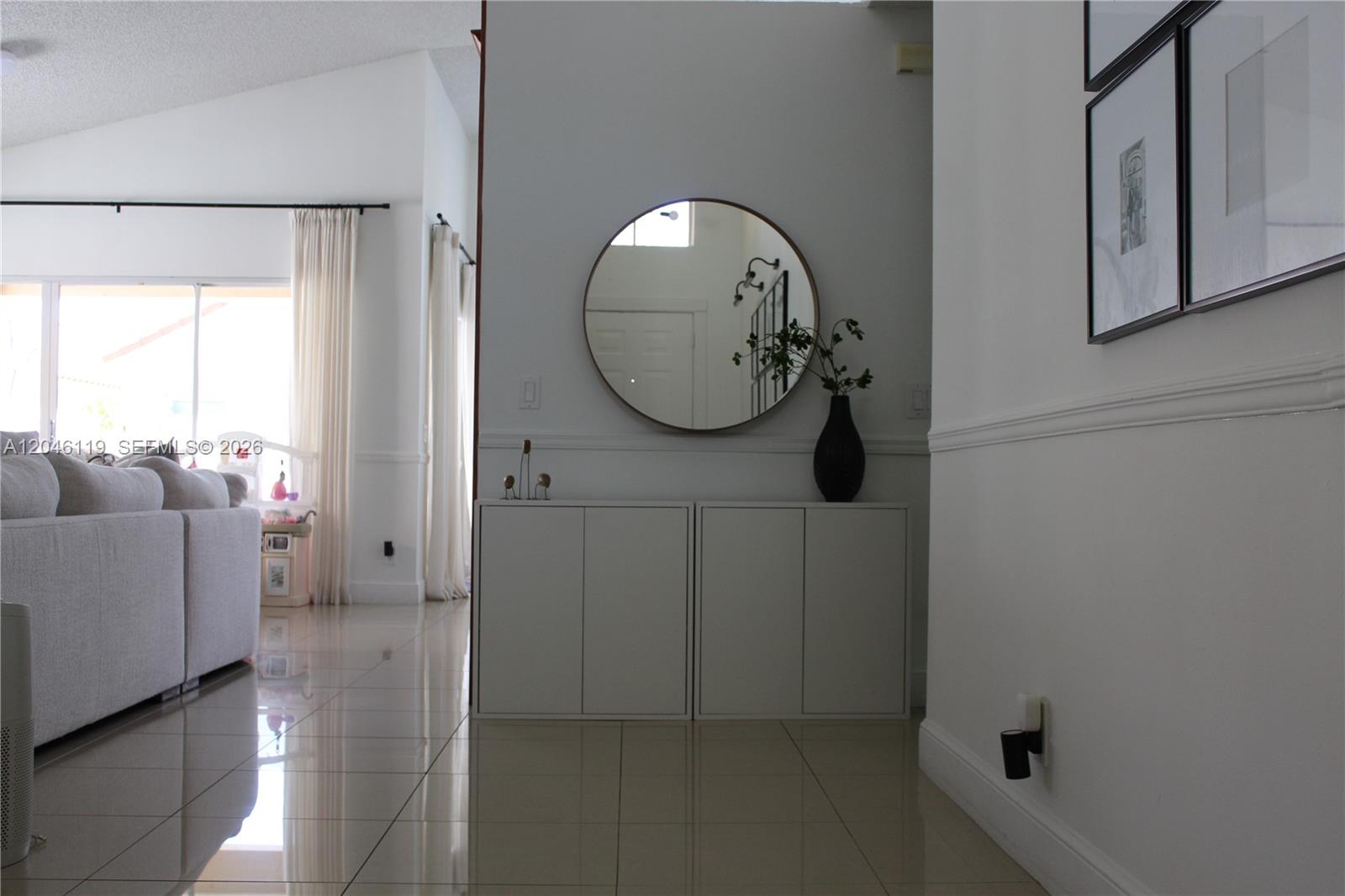 312 Bridgeton Road Weston, FL 33326 - Photo 10 of 13 a bathroom with a mirror and a shower