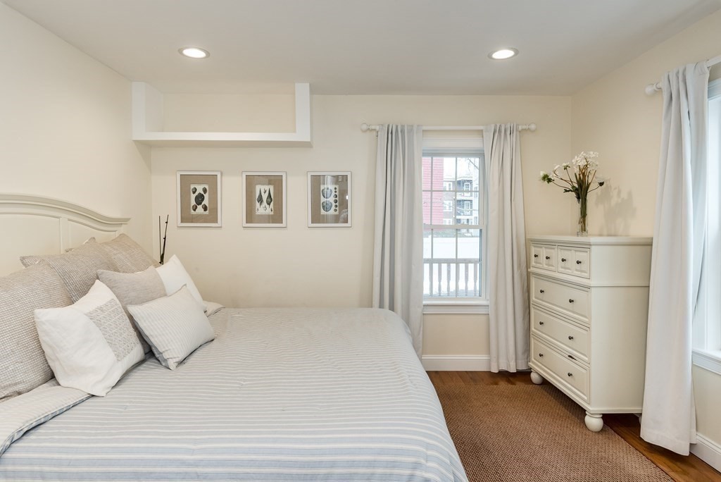 143 Williams Street, Unit 1 Boston, MA 02130 - Photo 15 of 19 a bedroom with a large bed and a window