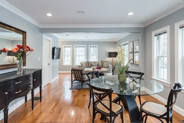 a view of a dining room with furniture and wooden floor