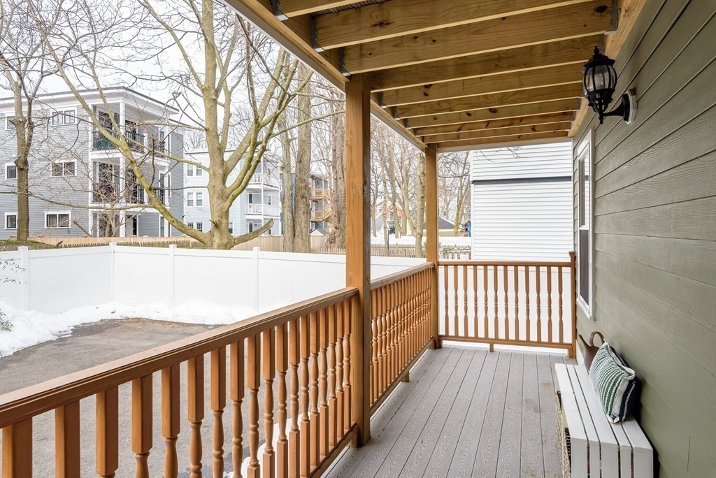 143 Williams Street, Unit 1 Boston, MA 02130 - Photo 8 of 19 a view of a porch with wooden floor and floor to ceiling window
