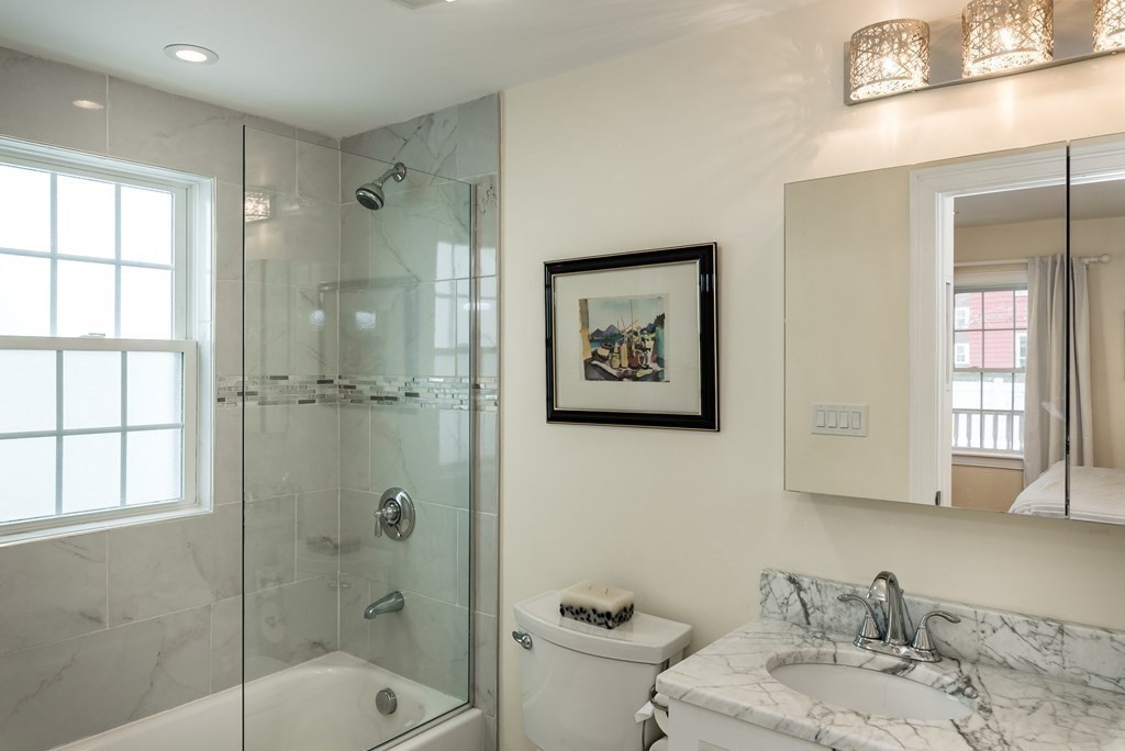 143 Williams Street, Unit 1 Boston, MA 02130 - Photo 10 of 19 a bathroom with a sink toilet and shower