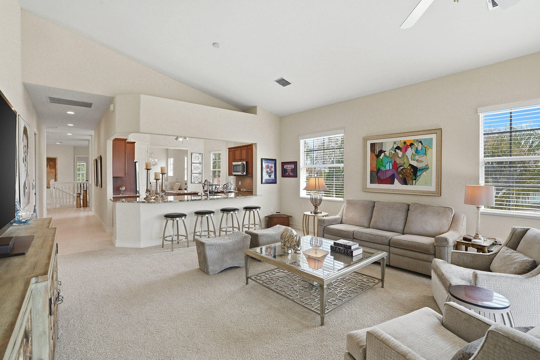 8605 Champions Point, Unit 103 Naples, FL 34113 - Photo 18 of 44 a living room with furniture and a large window