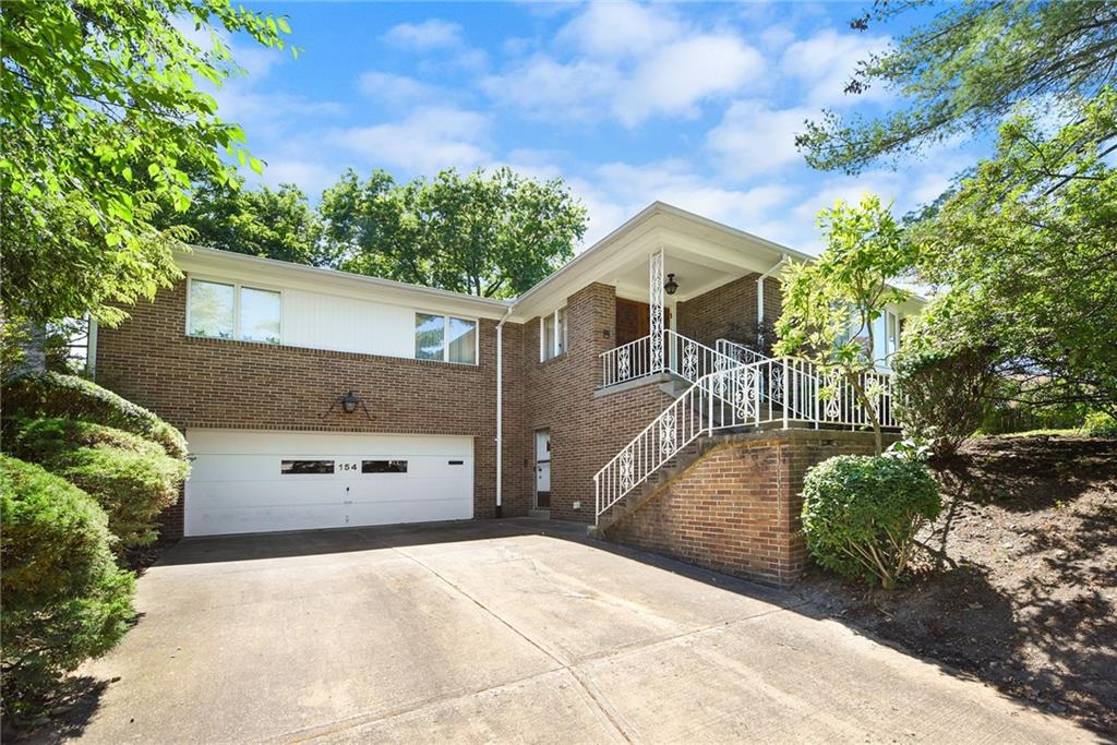 154 Gilda Avenue Pittsburgh, PA 15217 - Photo 1 of 25 a front view of a house with a yard