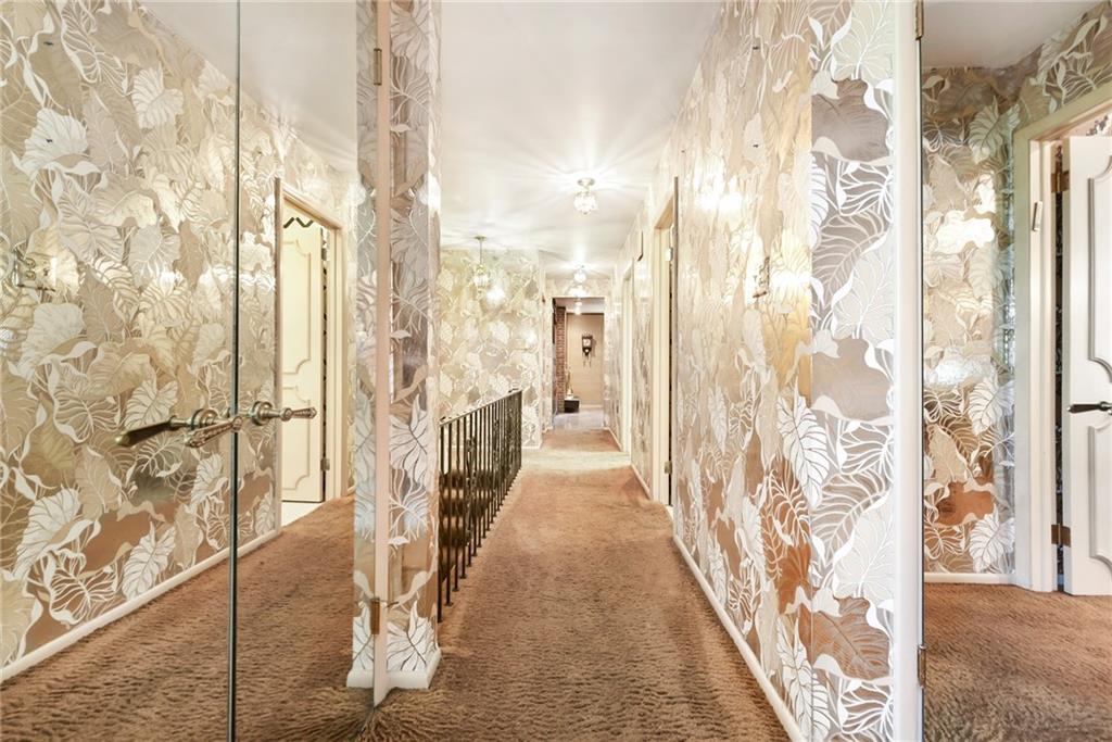 154 Gilda Avenue Pittsburgh, PA 15217 - Photo 14 of 25 a hallway with a white house next to a yard