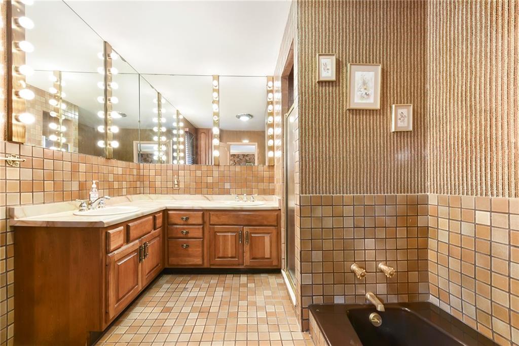 154 Gilda Avenue Pittsburgh, PA 15217 - Photo 20 of 25 a large kitchen with a sink and cabinets