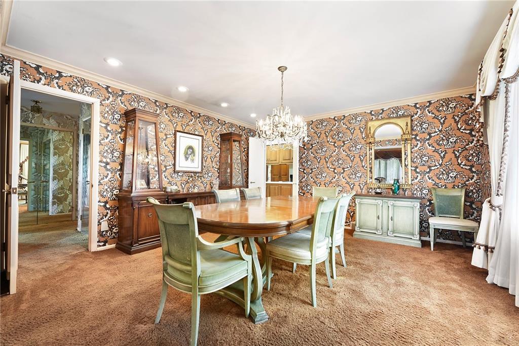 154 Gilda Avenue Pittsburgh, PA 15217 - Photo 6 of 25 a view of a dining room with furniture and chandelier