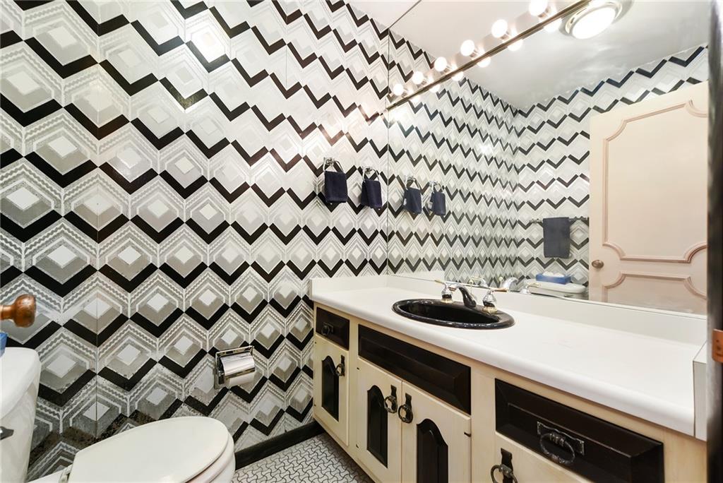 154 Gilda Avenue Pittsburgh, PA 15217 - Photo 7 of 25 a bathroom with a sink and a mirror