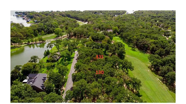 an aerial view of residential house with outdoor space and river