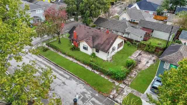 an aerial view of a house with a garden