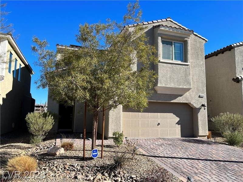 6844 Pivot Point Street Las Vegas, NV 89148 - Photo 2 of 2 This charming home offers a paved driveway and an attached garage.