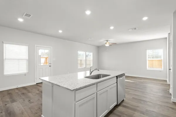 a kitchen with sink and window