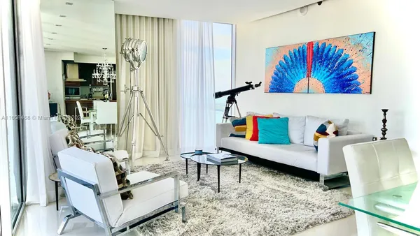 a living room with furniture and a rug