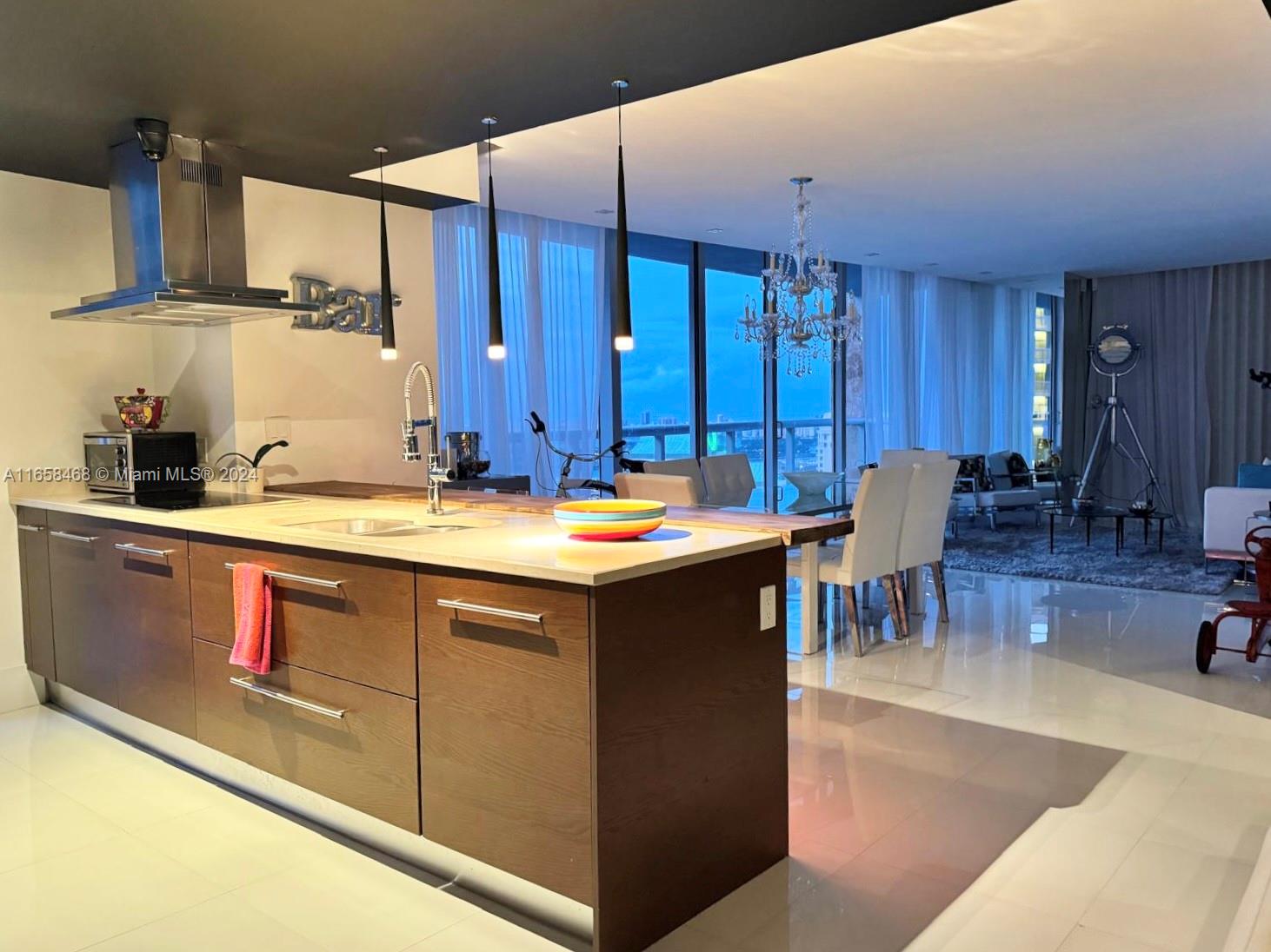 495 Brickell Avenue, Unit 4902 Miami, FL 33131 - Photo 8 of 24 a kitchen with a sink and cabinets