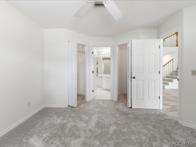 709 Moray Drive Inverness, FL 34453 - Photo 23 of 55 Primary Bedroom with dual walk-in closets
