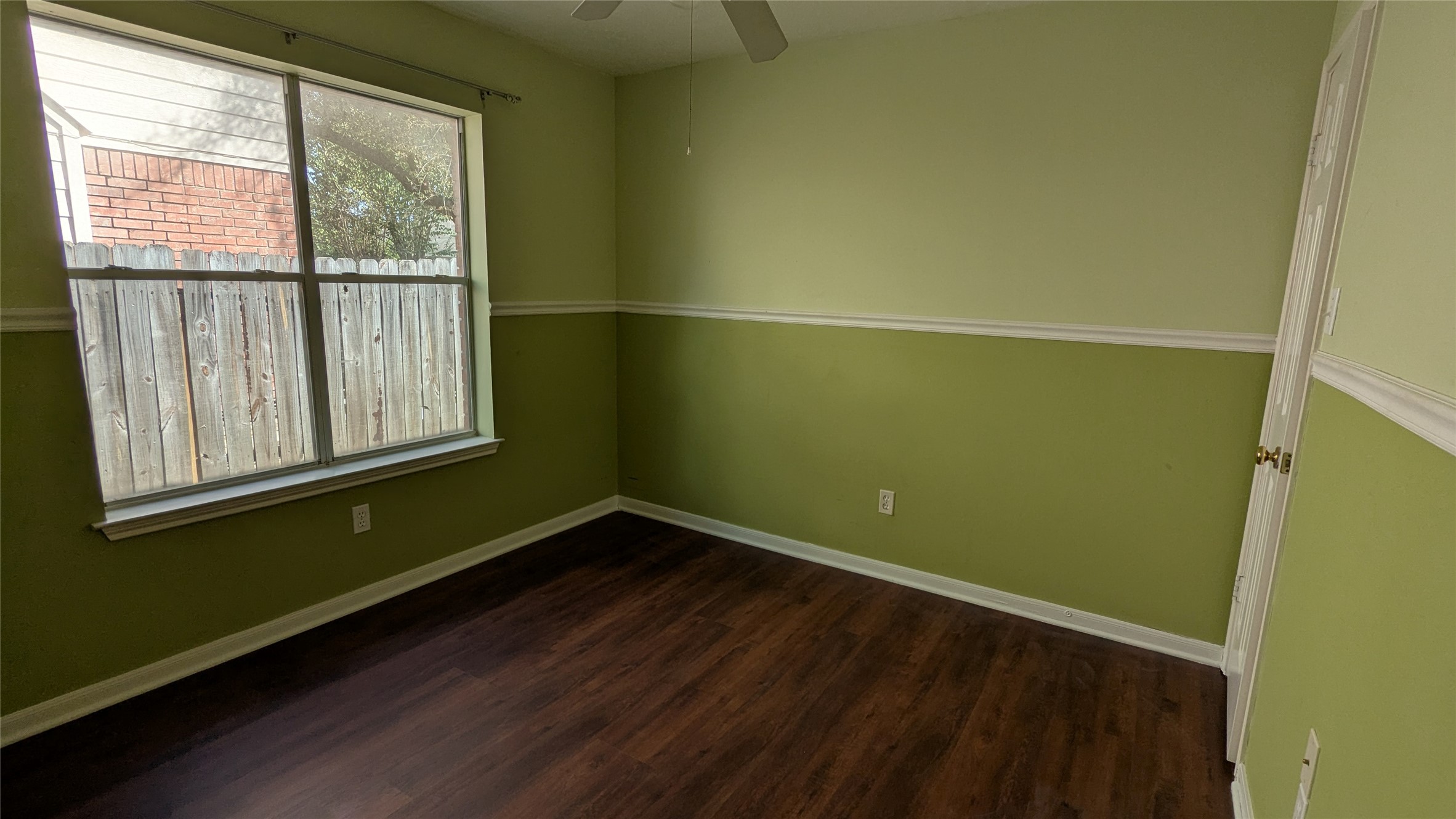 18319 North Willow Bluff Road Katy, TX 77449 - Photo 14 of 23 a view of a room with wooden floor and a window