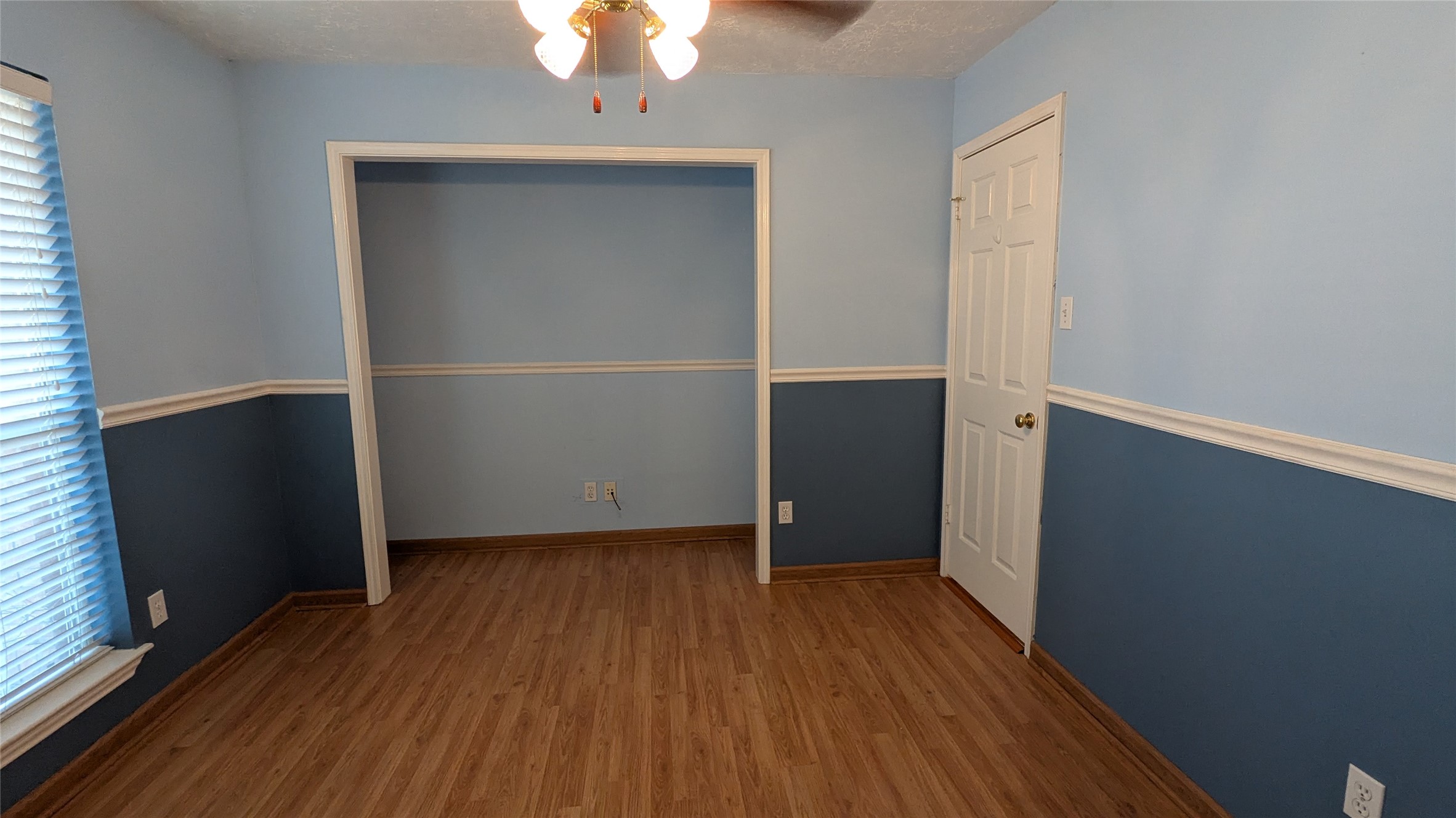 18319 North Willow Bluff Road Katy, TX 77449 - Photo 15 of 23 an empty room with wooden floor and closet