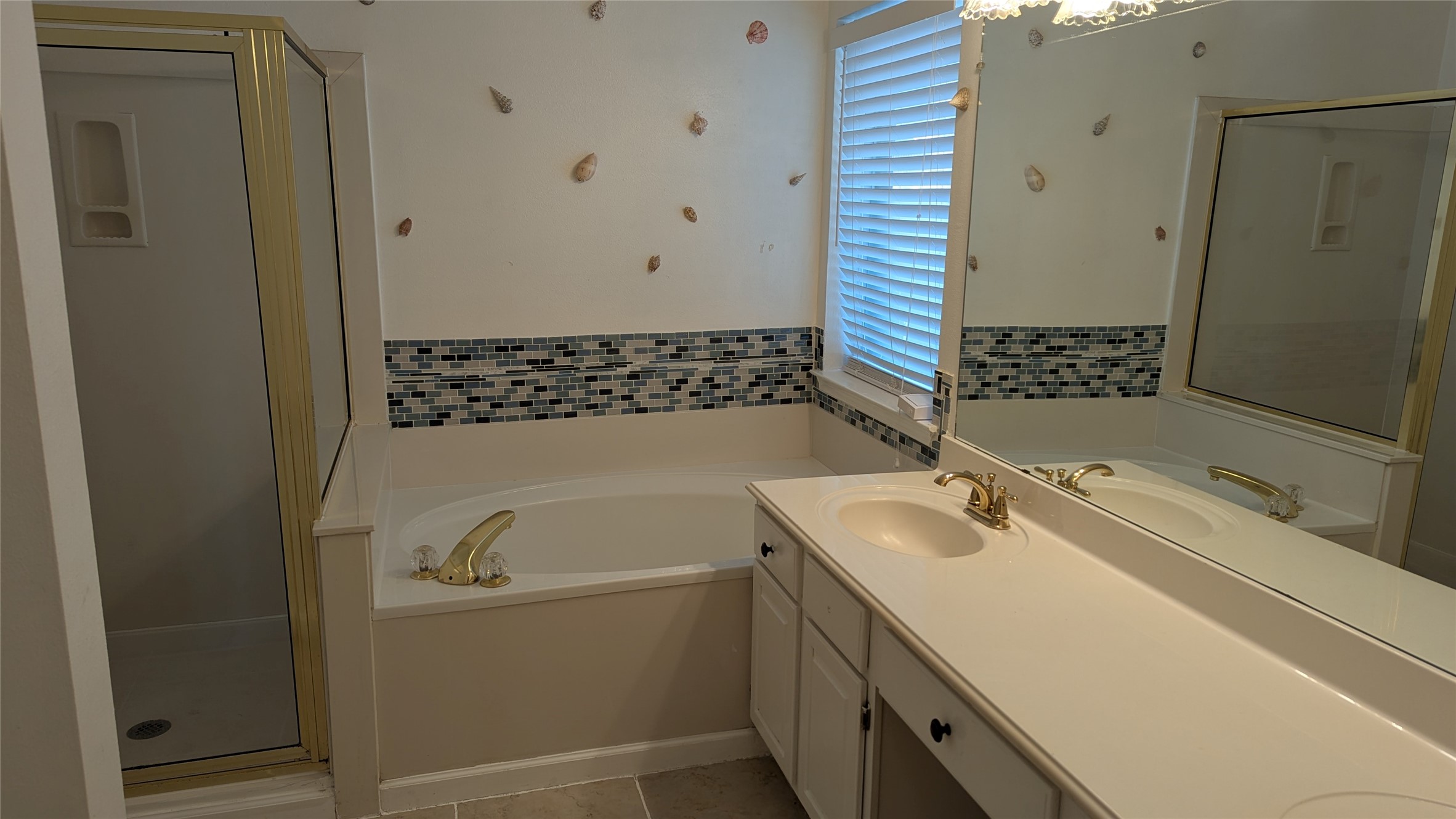 18319 North Willow Bluff Road Katy, TX 77449 - Photo 7 of 23 a bathroom with a sink and a bathtub