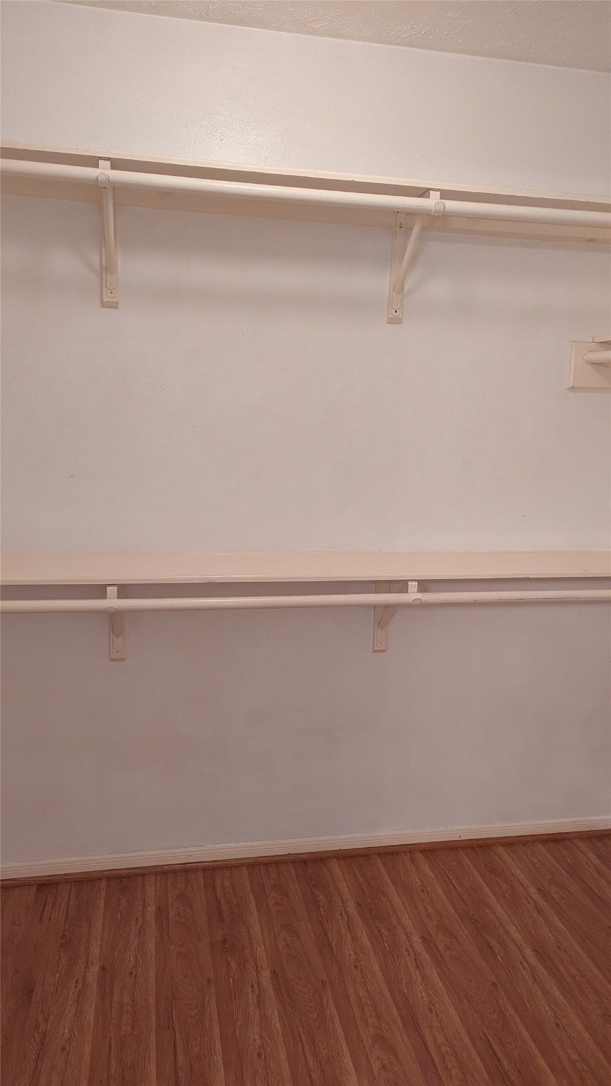 18319 North Willow Bluff Road Katy, TX 77449 - Photo 8 of 23 a view of a room with wooden floor