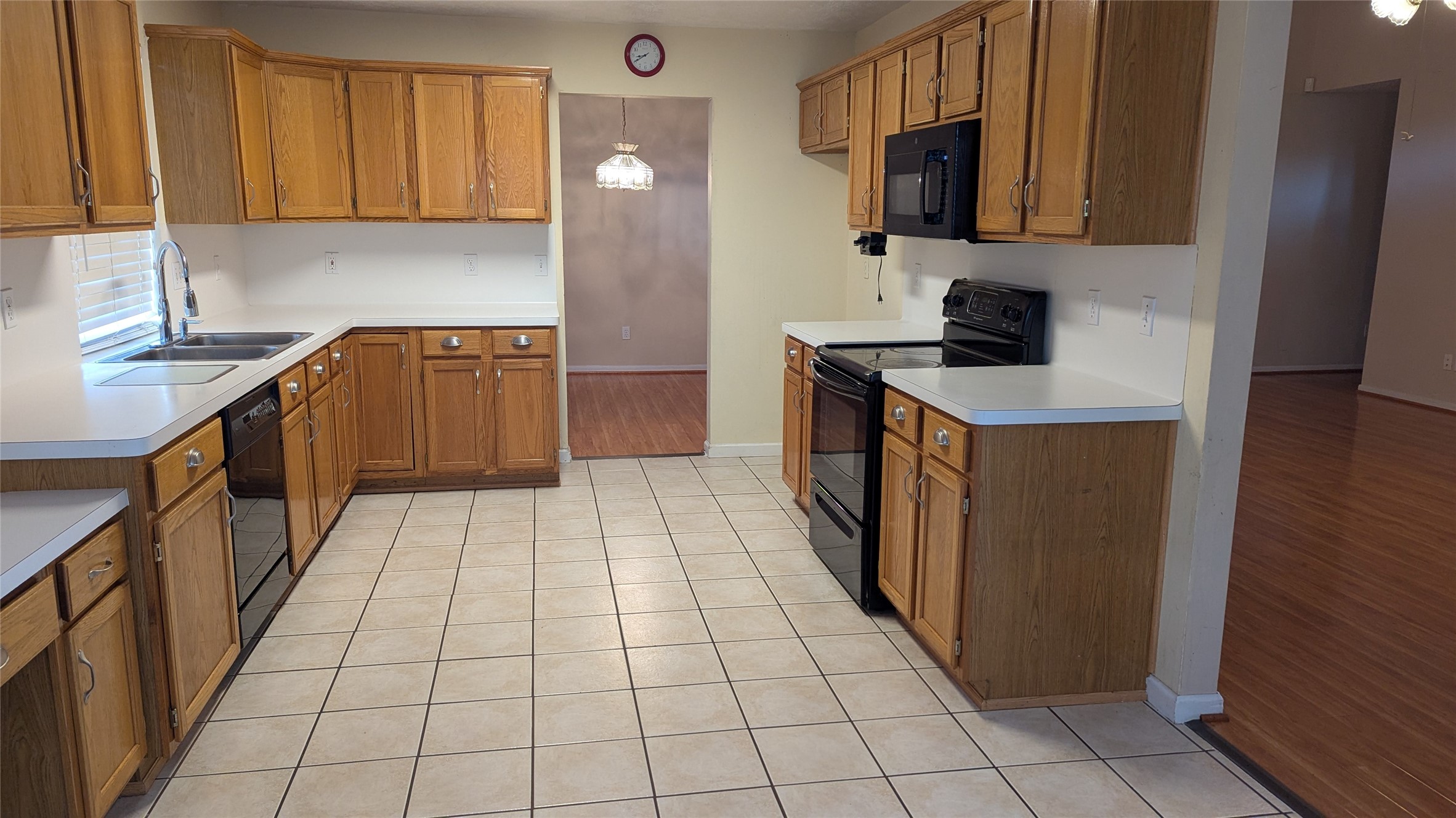 18319 North Willow Bluff Road Katy, TX 77449 - Photo 10 of 23 a kitchen with a sink a stove and cabinets