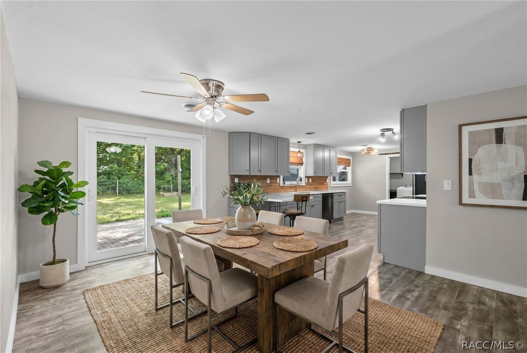 107 Allen Avenue Inglis, FL 34449 - Photo 6 of 36 a view of a dining room with furniture window and wooden floor