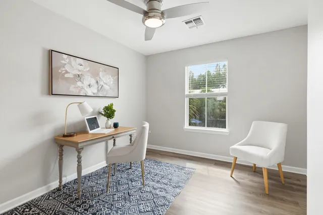 a work room with furniture and a window